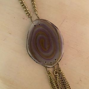 purple and gold colored tase stone necklace